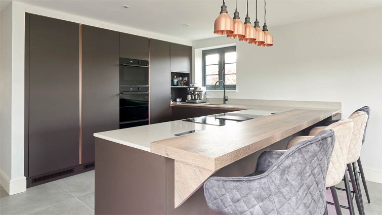 Modern minimalism exhibited in a modern kitchenette with a peninsula breakfast bar