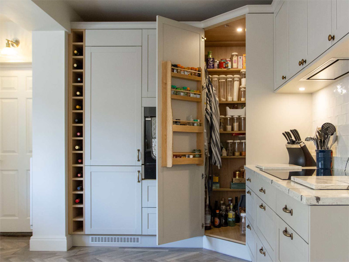 A minimalist-style kitchen with minimalist kitchenware and a large corner pantry