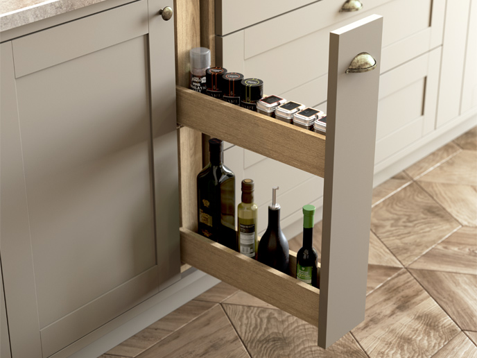 A mushroom colour kitchen cabinet showing a spice larder