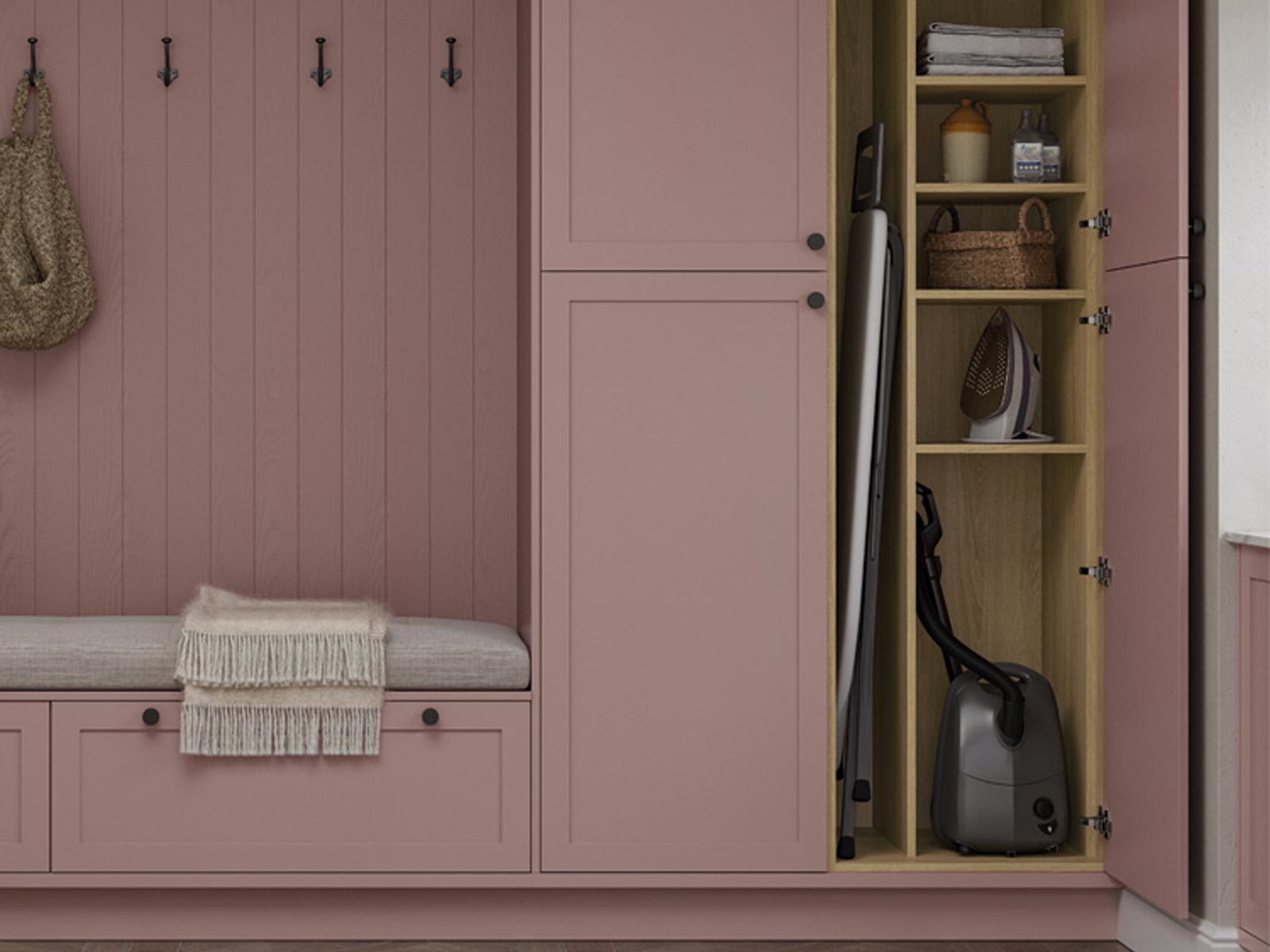 Utility room cupboard with oak divider in a pink unit