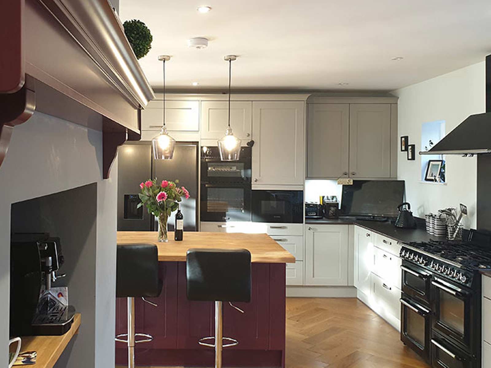 Shaker kitchen with purple kitchen island and mantle