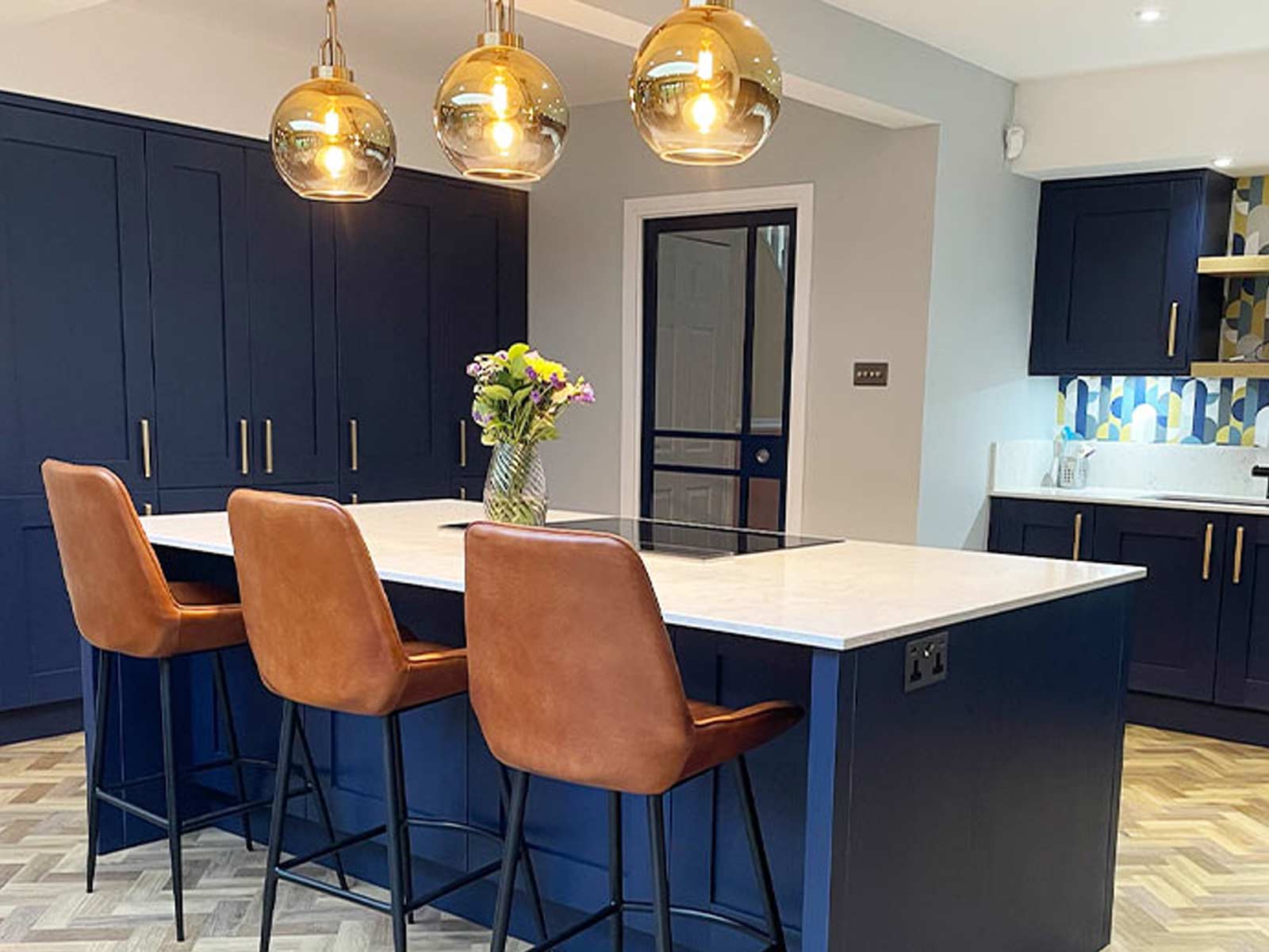 Dark blue shaker kitchen with island