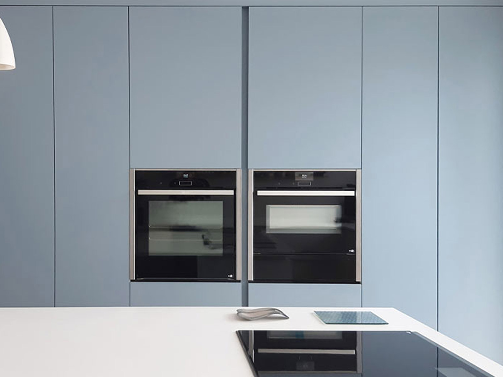 Light blue kitchen with a light kitchen island