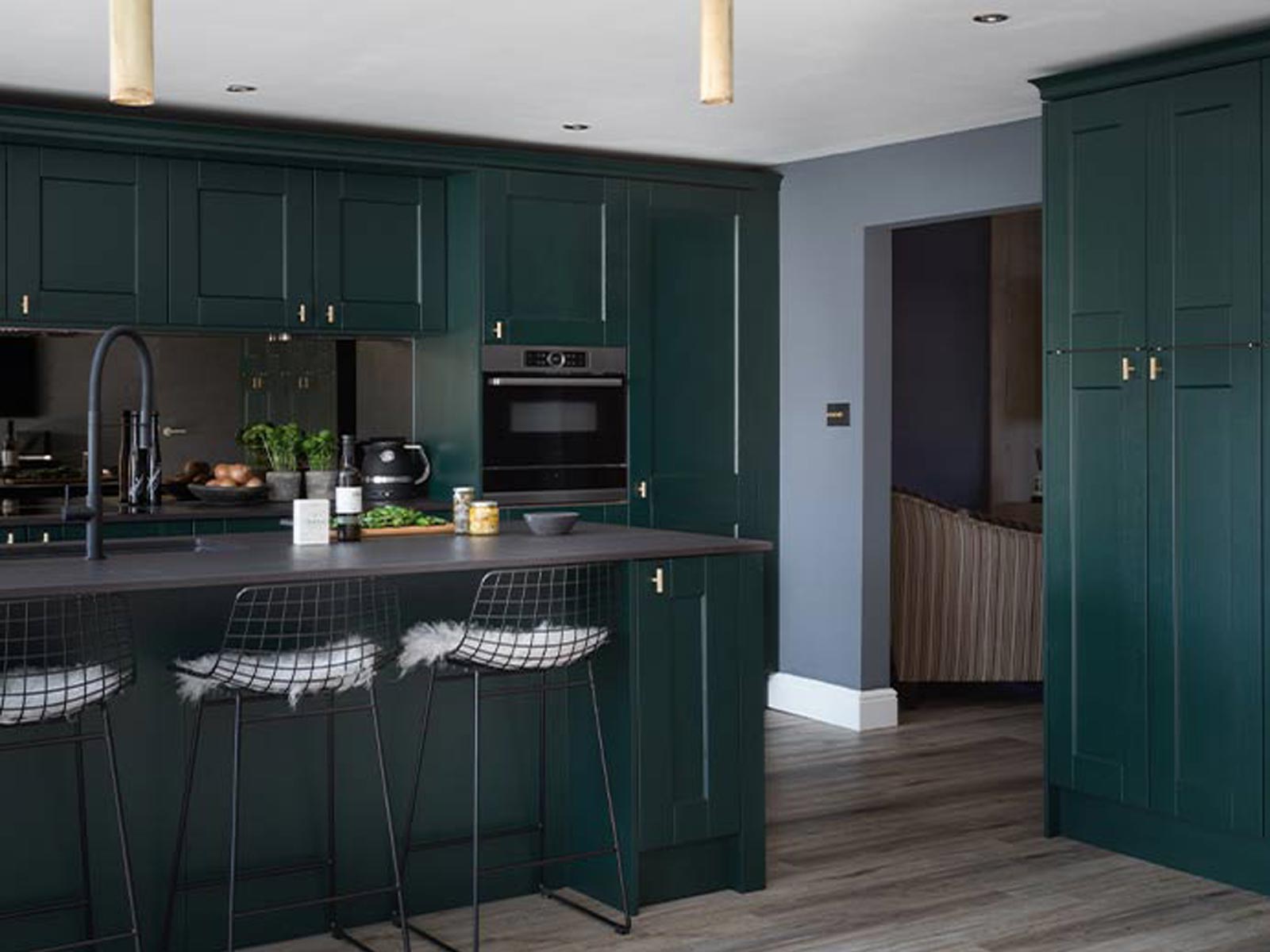Dark green shaker kitchen with gold handles