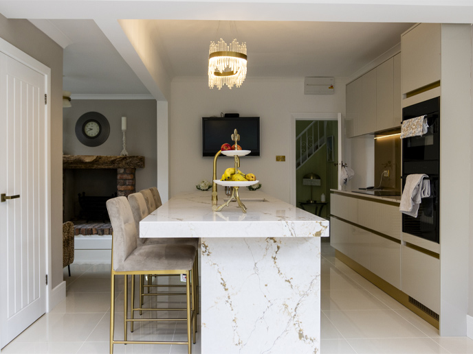 A modern kitchen island demonstrating how much overhang for a kitchen island you need for seating