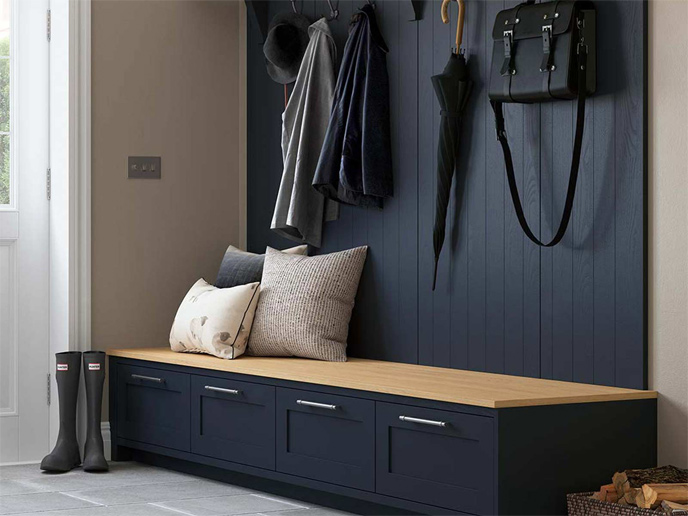 A navy boot room unit with drawers and Portland Oak seating