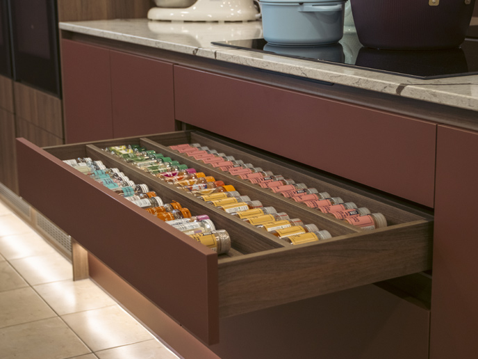 A spice rack drawer insert showing in-drawer spice storage