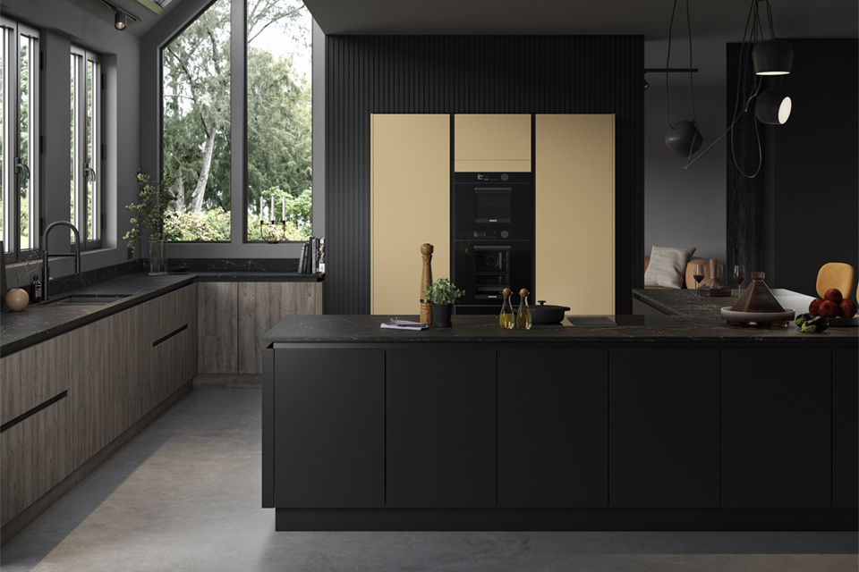 A black kitchen range with mustard yellow kitchen accents used on a feature wall