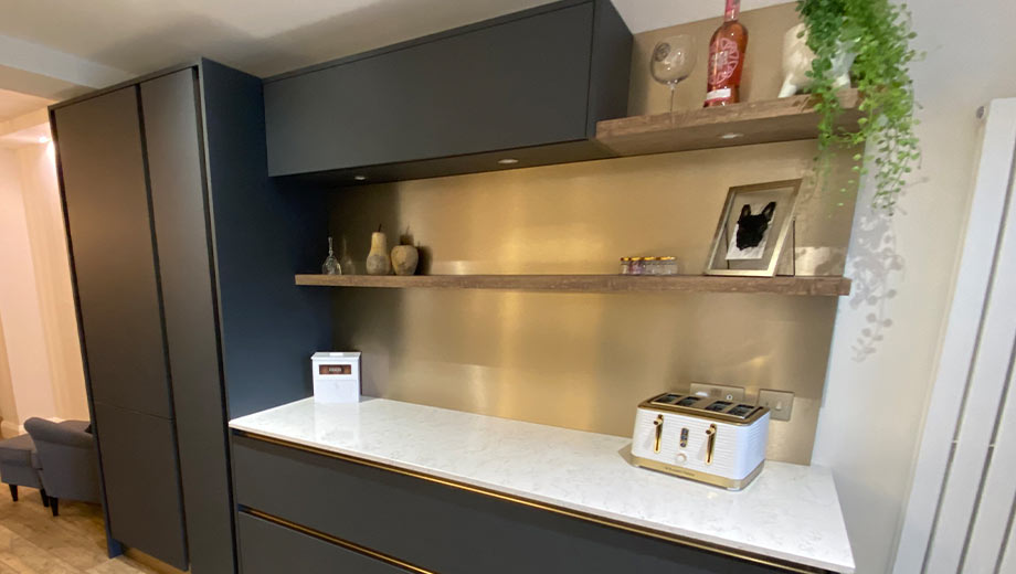 Metallic feature wall splashback in a modern kitchen