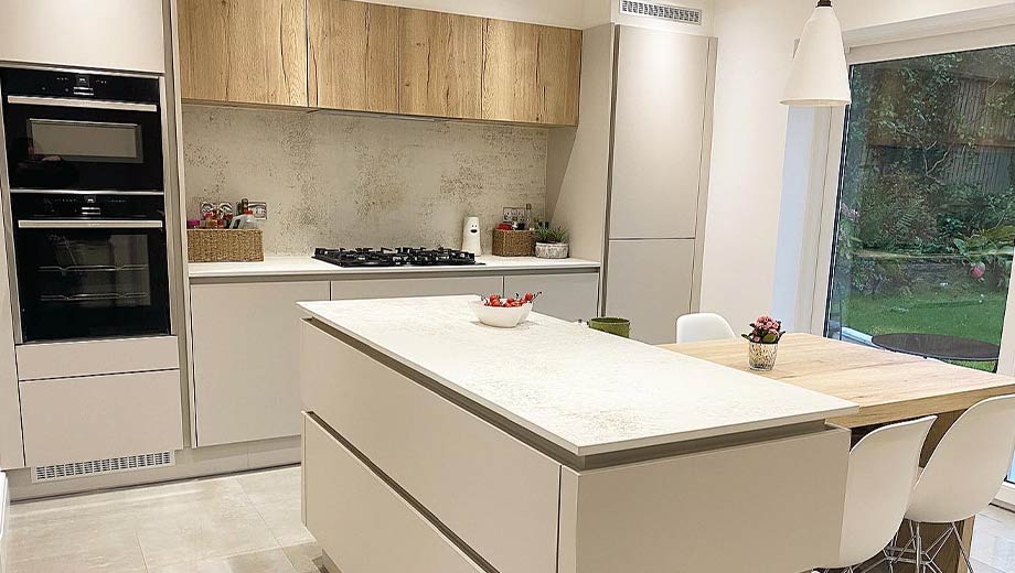 Modern grey kitchen with wood effect accent colours