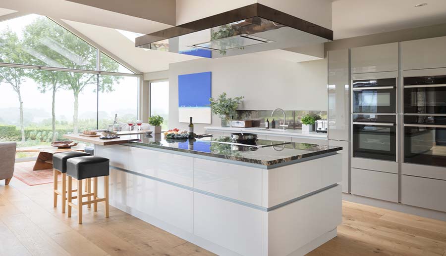 Modern grey kitchen featuring large kitchen island