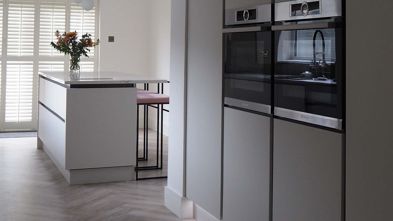 Modern kitchen featuring eye level ovens