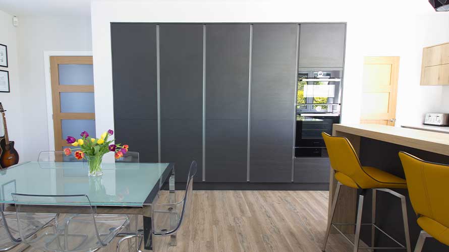 Tall modern kitchen cabinets in an open plan kitchen