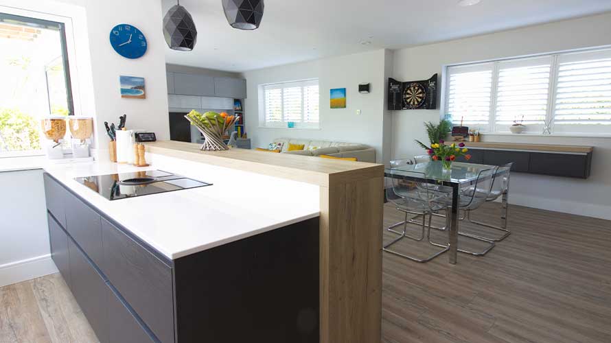 A modern handleless kitchen with open plan living space