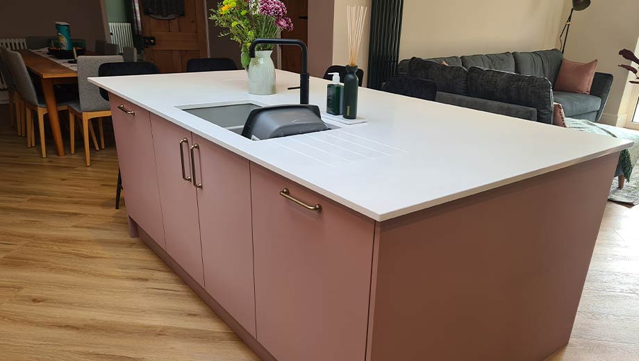 Pink kitchen island in a modern kitchen