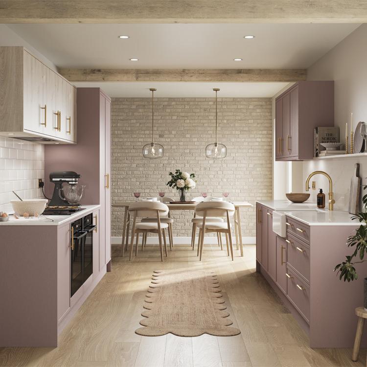 A pink wooden kitchen with pink pastel kitchen doors