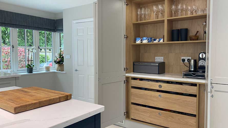 Multifunctional drinks cabinet in a grey shaker kitchen