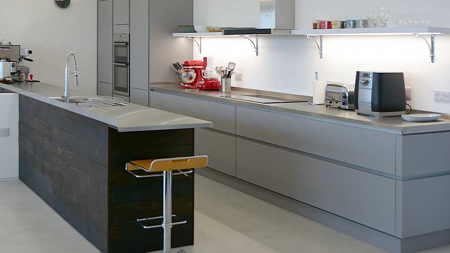 Extra wide modern drawers with handleless doors in a small narrow kitchen