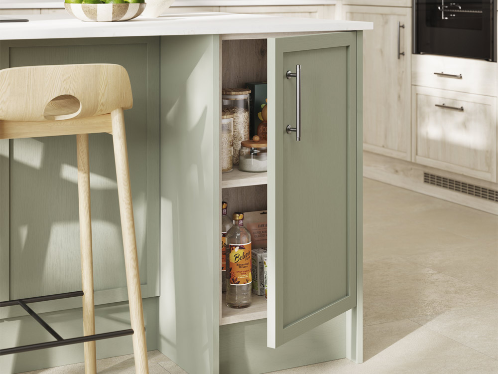 Pale green skinny Shaker kitchen cupboard door and internal cabinetry