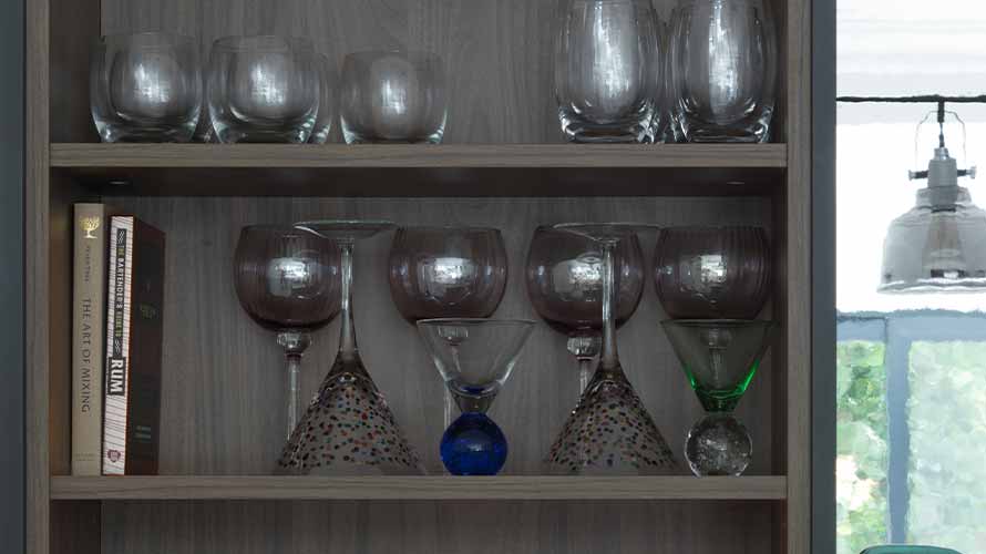 Home bar open shelving in a shaker kitchen