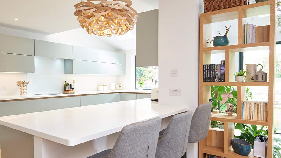 Tall kitchen shelves in an open-plan kitchen